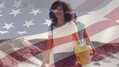 animation of flag of united states of america over happy african american couple on beach