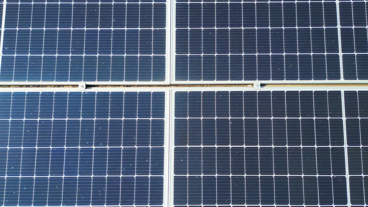 Aerial view looking down on solar panels on the roof of a house