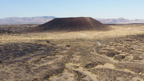 aerial view of the amboy crater with its lava field around it