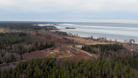 drone view of rural swedish landscape by large inland lake