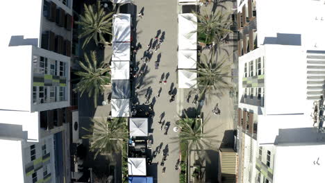aerial view of a bustling outdoor market or street fair