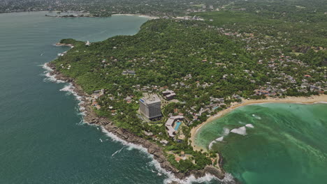 unawatuna sri lanka aerial v4 cinematic birds eye view drone flyover coastal bay capturing rocky shoreline of yaddehimulla and oceanfront resort hotels from above - shot with mavic 3 cine - april 2023