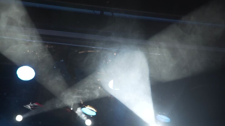 white beam robotic concert lights with haze, equipment B-roll footage 3