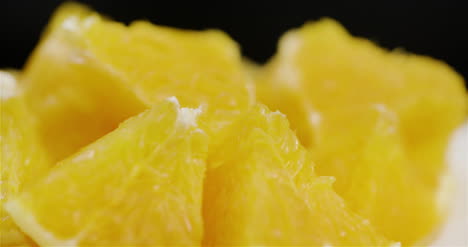 Extreme-Close-Up-Of-Sliced-Orange-Rotating-On-Plate-1