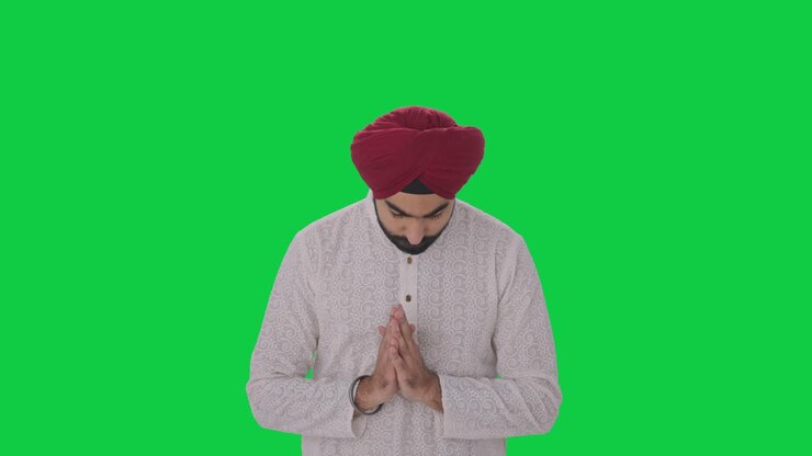 Religious Sikh Indian man praying to God Green screen