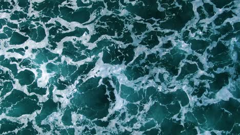 close up birds eye view footage of deep blue ocean white wash in hawaii