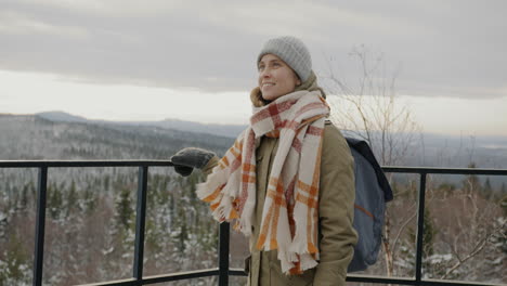 woman enjoying a winter mountain view