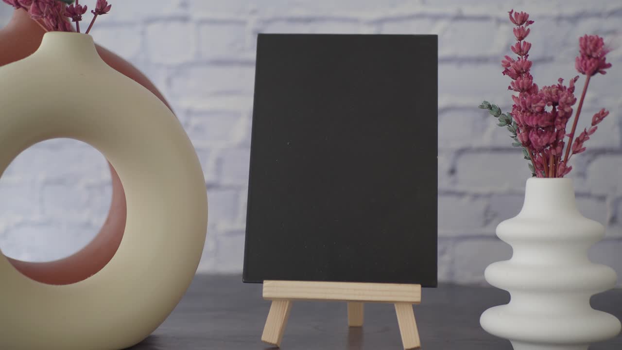 Blank Blackboard Display with Dried Flowers and Vases