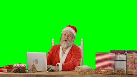 Papá-Noel-Usando-La-Computadora-Portátil