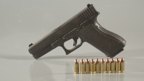 dolly out from 9mm handgun, revealing ammunition