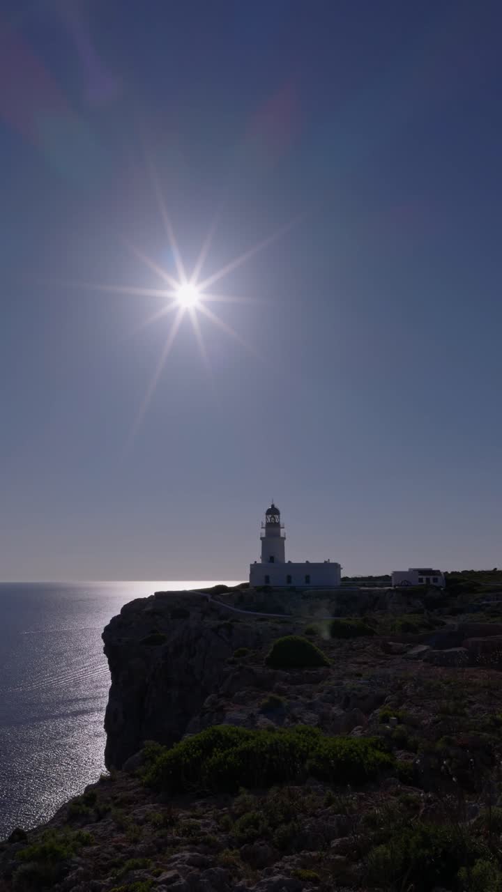 Menorca Cape Cavalleria Lighthouse historical landmark, aerial drone vertical video