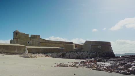 Building-Fortress-Heritage-Travel-Sunny-Old-building-Clowds-Portugal-Stones-Shore-Sea-Steady-Shot