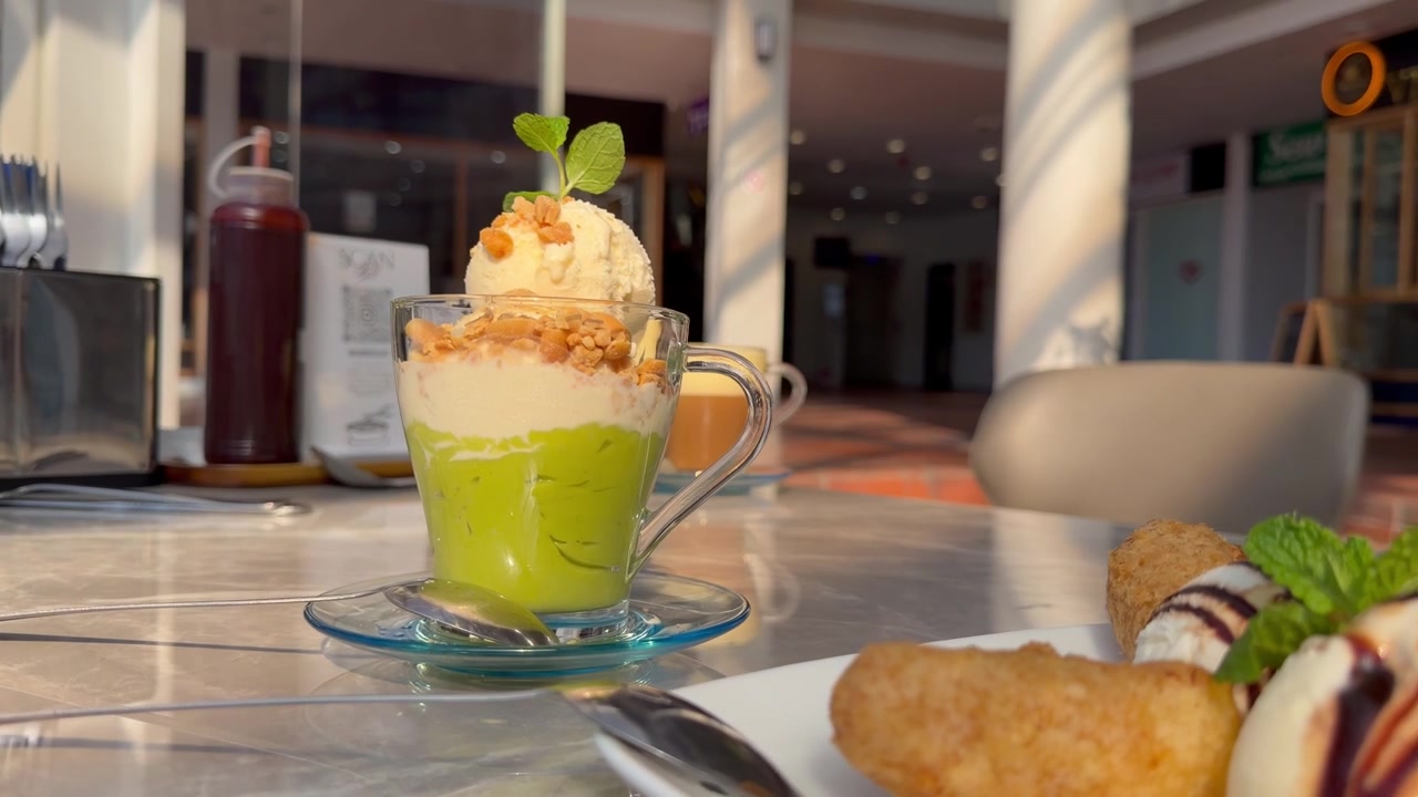An array of Vietnamese sweet treats on a table in a restaurant.