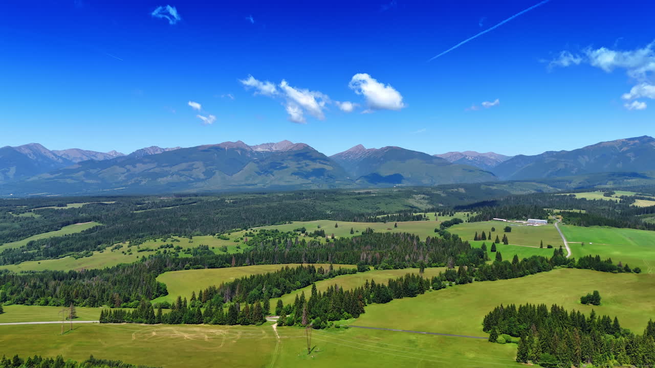 Nature landscapes on a beautiful sunny day from drone. Approaching the Tatras mountain range in Slovakia
