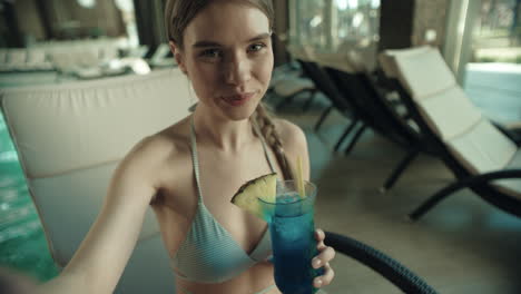 Portrait-of-attractive-girl-call-video-chat-online-on-mobile-phone-at-pool