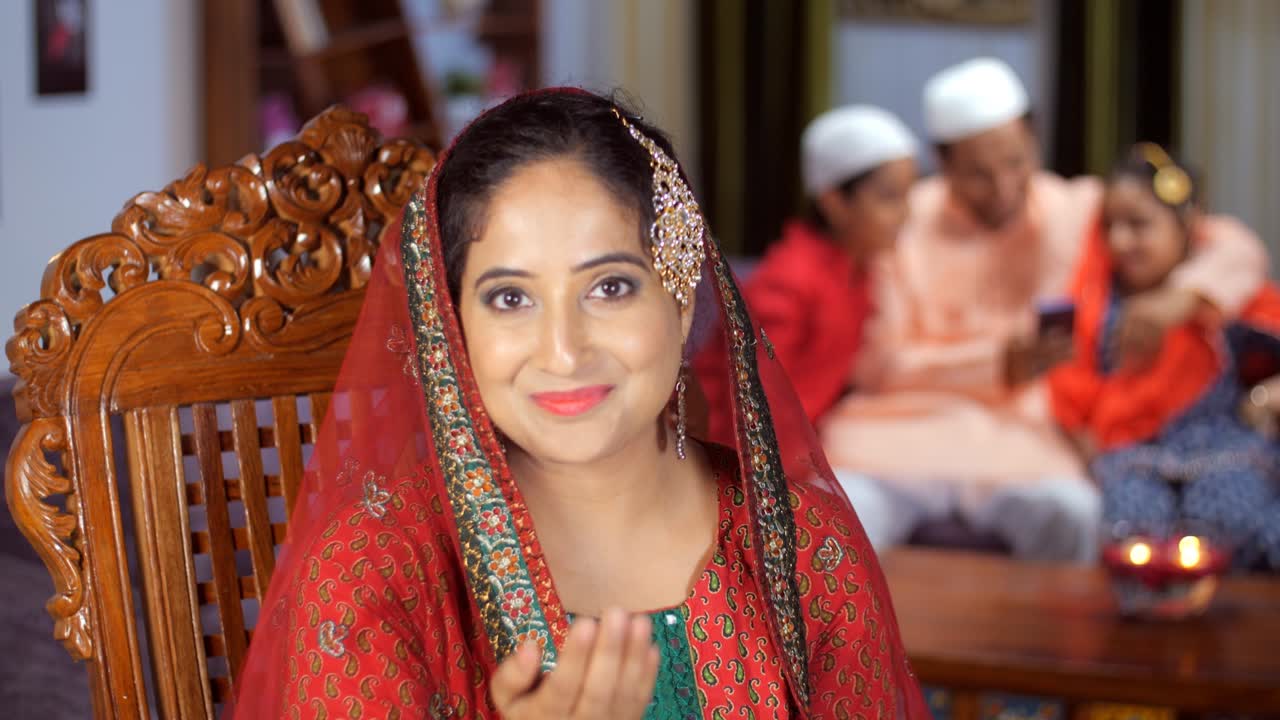 A beautiful Muslim lady wearing a headscarf doing a Saalam-Alaikum gesture - Eid celebrations, hello by Mohammedans