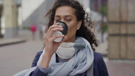 portrait beautiful mature business woman drinking coffee waiting relaxed professional female in city street commuting slow motion