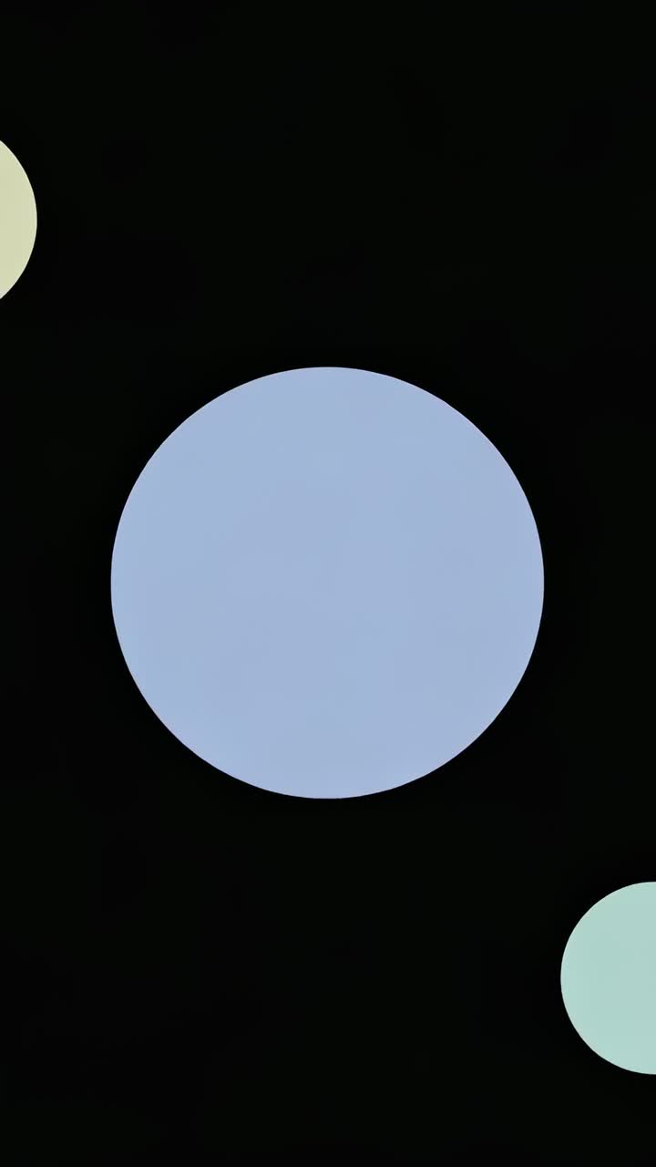 Vertical video: Mint-green shape entering frame, morphing into oval overlapping light-blue circle