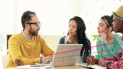 Animation-of-statistical-data-processing-over-diverse-colleagues-discussing-over-a-laptop-at-office