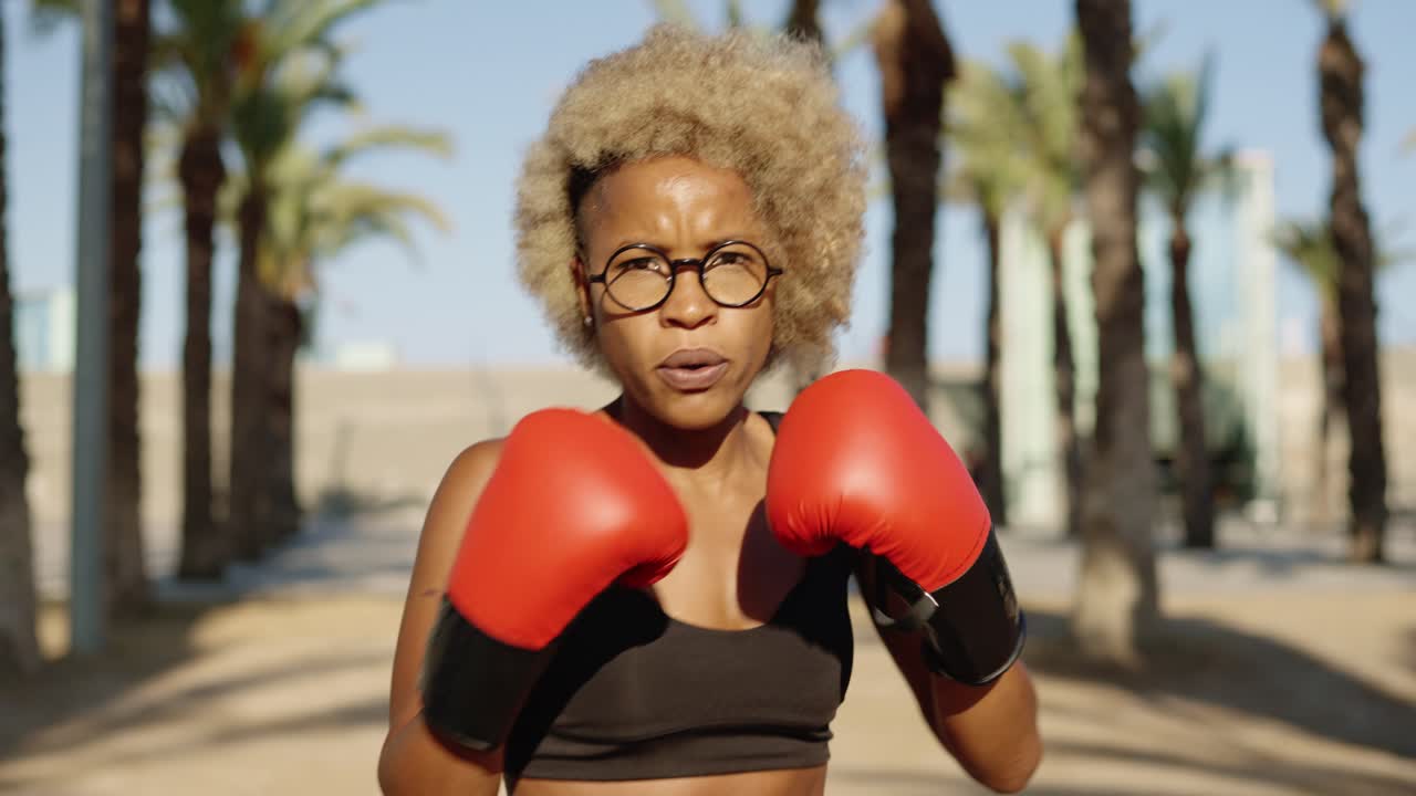Woman boxing outdoors