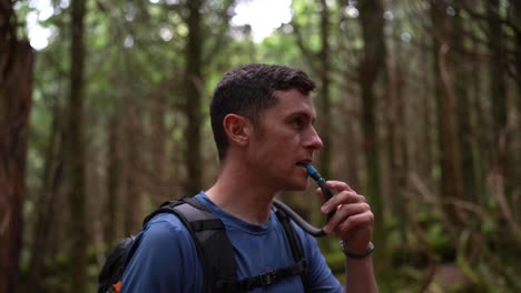 attractive young man laughs with his hiking companion