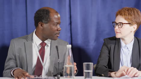 press conference participants having discussion