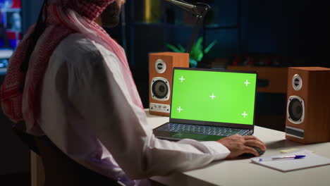 man writing emails on mockup laptop