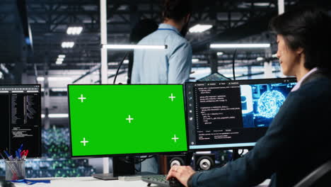 technician in data center coding with generative ai on green screen pc