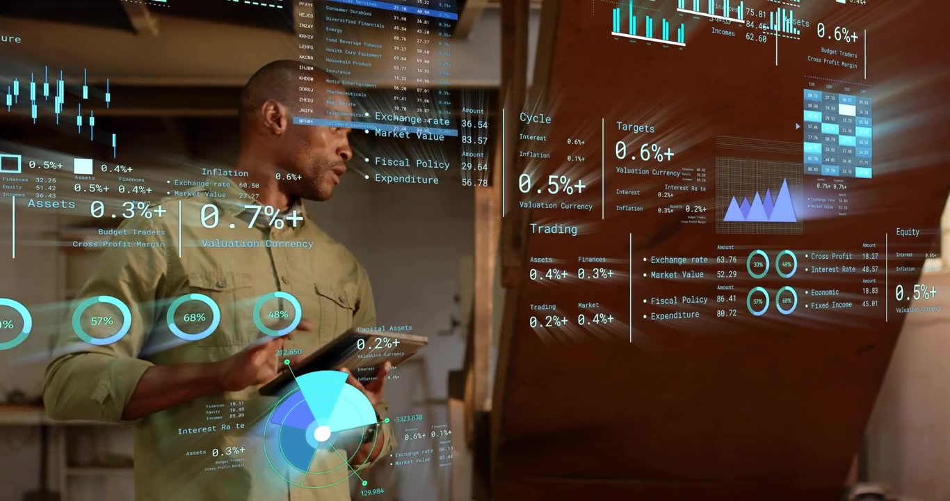 Financial analyst in workshop tapping tablet and swiping, projecting holographic charts for review