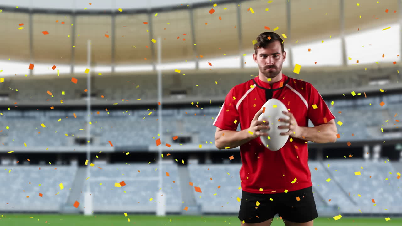 프로 럭비 선수 가 콘페티 가 떨어지는 경기장 앞 에 서 있다