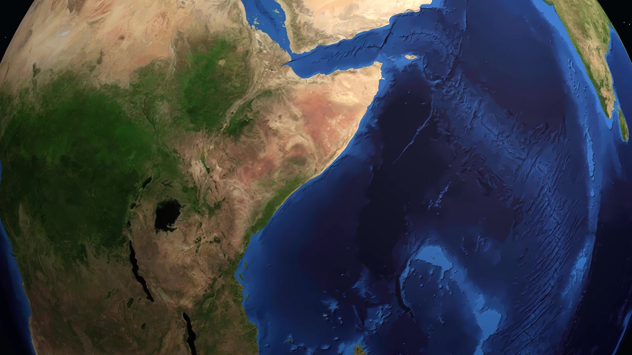 Un globo digitale ruota e si ingrandisce su Mogadiscio, Somalia, mostrando il nome della città e le statistiche sulla popolazione.