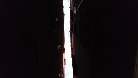 narrow distance between buildings in waterways at the old city of venice, italy