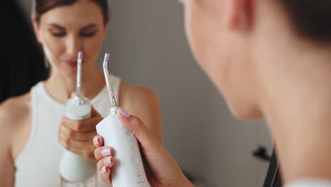 woman using a water pick