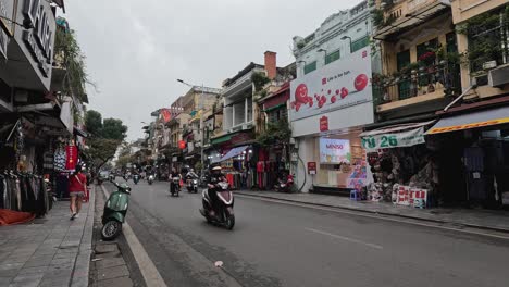 busy street with motorbikes and pedestrians