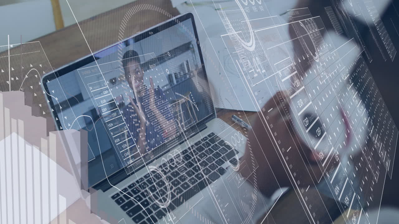 Using laptop with digital data overlay, business professional working in office