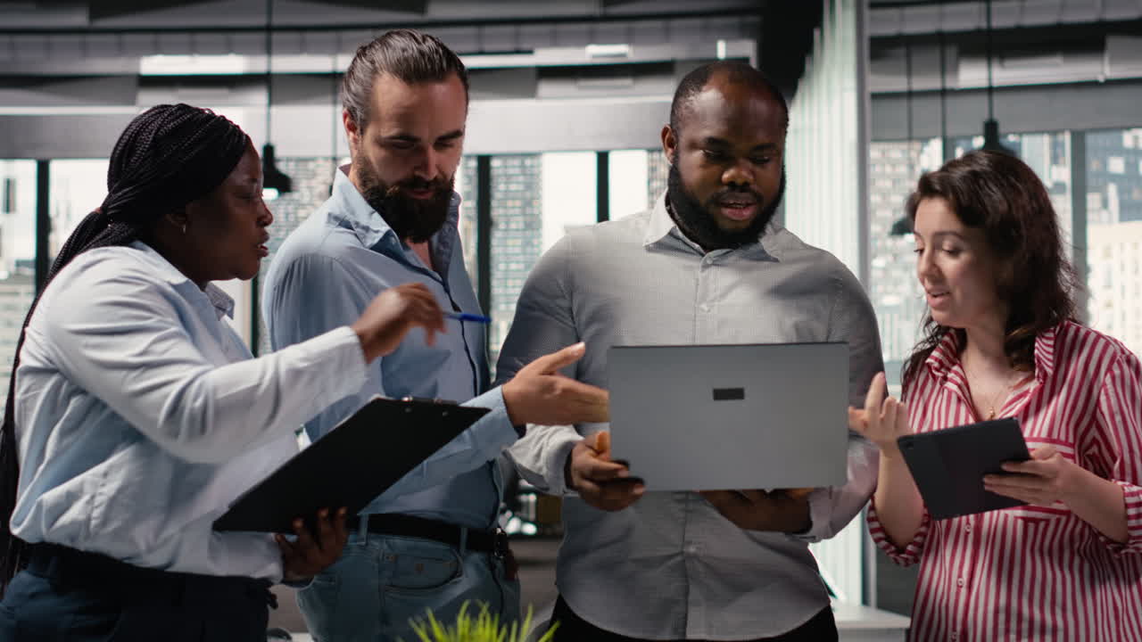 Diverse Business Team Collaborating on Project in Modern Office