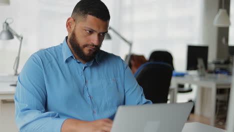 concentrated creative manager working at modern office.