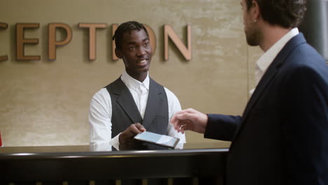 man checking in at the hotel