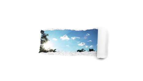creative 4k time laps video of fast moving clouds in the blue sky that are visible through a hole with torn edges in white paper. the concept of opportunities, a happy future.