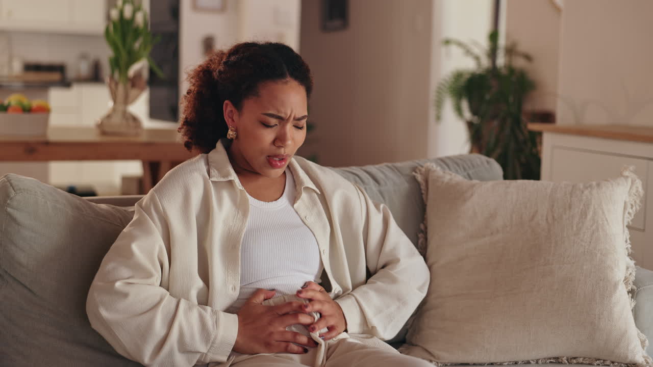 Woman experiencing abdominal pain