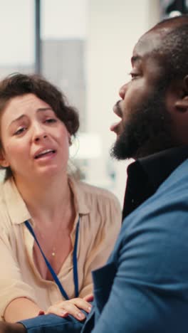 vertical video exasperated black manager dealing with a stressful situation at the office