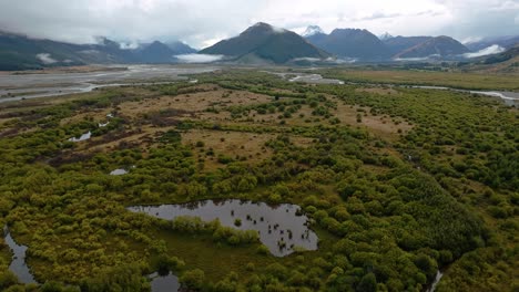 Panoramic-aerial-above-beech-forest-along-majest-lowlands-of-Glenorchy-New-Zealand