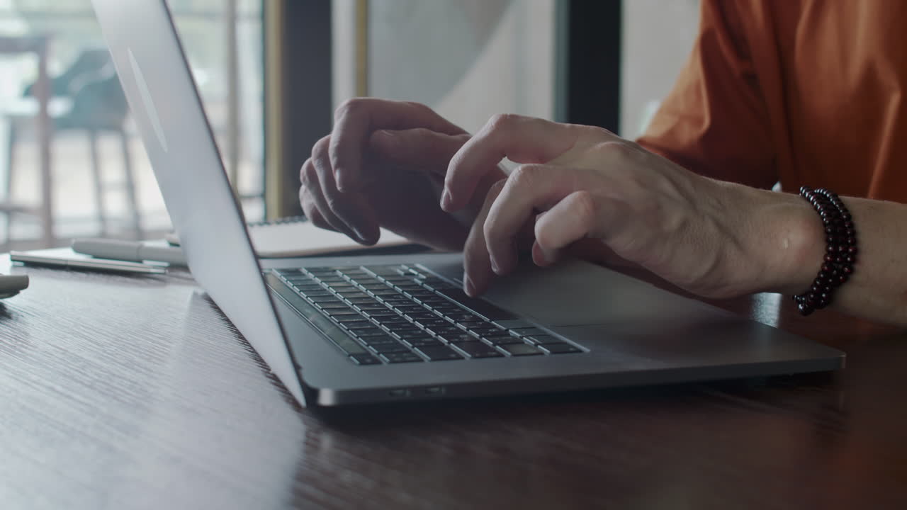 Hands of Male Entrepreneur Typing on Laptop
