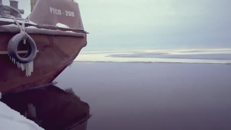 ice-covered river with a ship