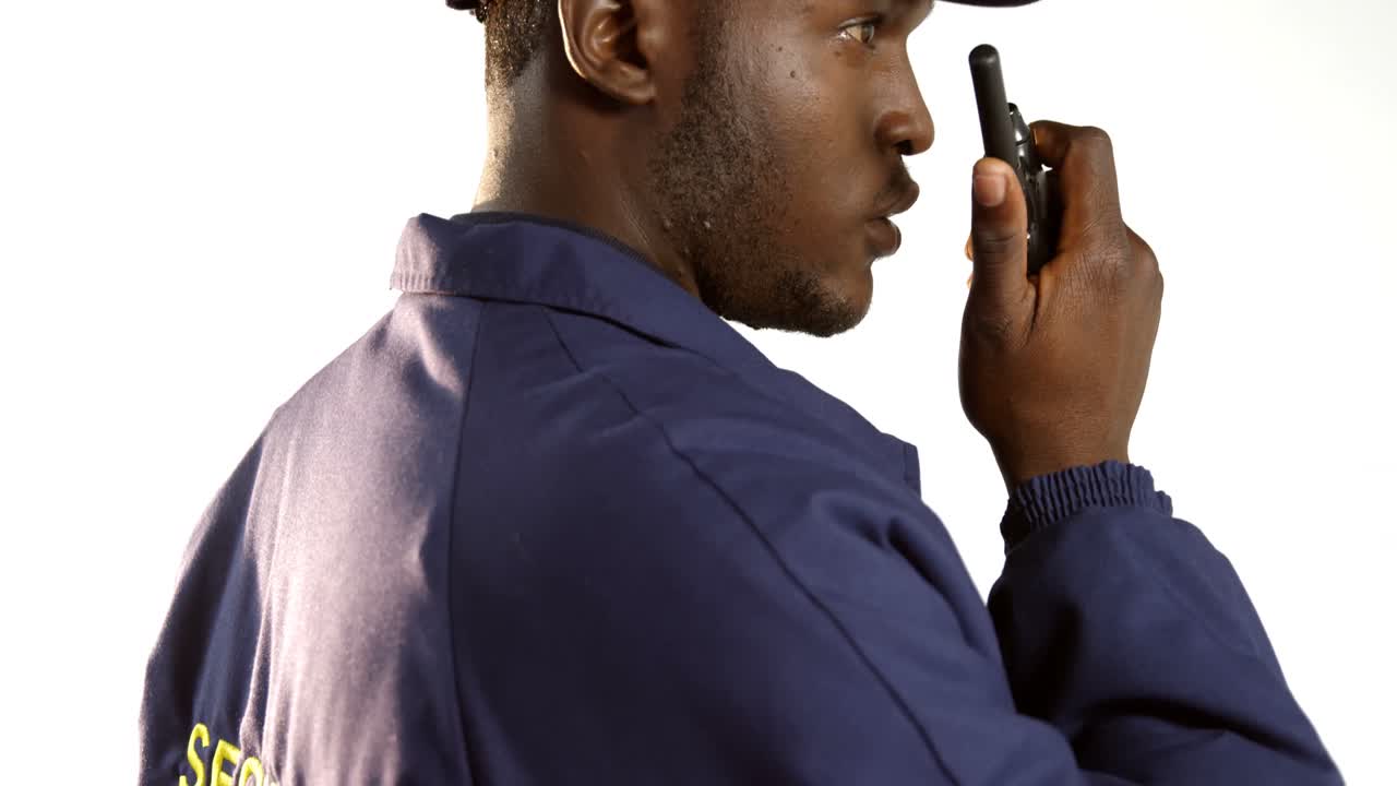 Security officer talking on walkie-talkie