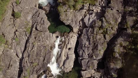 Top-shot-of-a-small-river-with-rapids-and-pools-in-northern-Norway