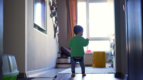 baby learning to walk in a cozy living room