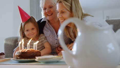 multi-generation family celebrating birthday on sofa 4k
