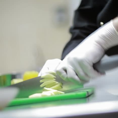 chef hands cutting potato