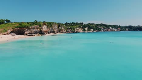 Dreamland Beach Bali from above, aerial 4k footage. Azure water and punch colors, white sand beach.